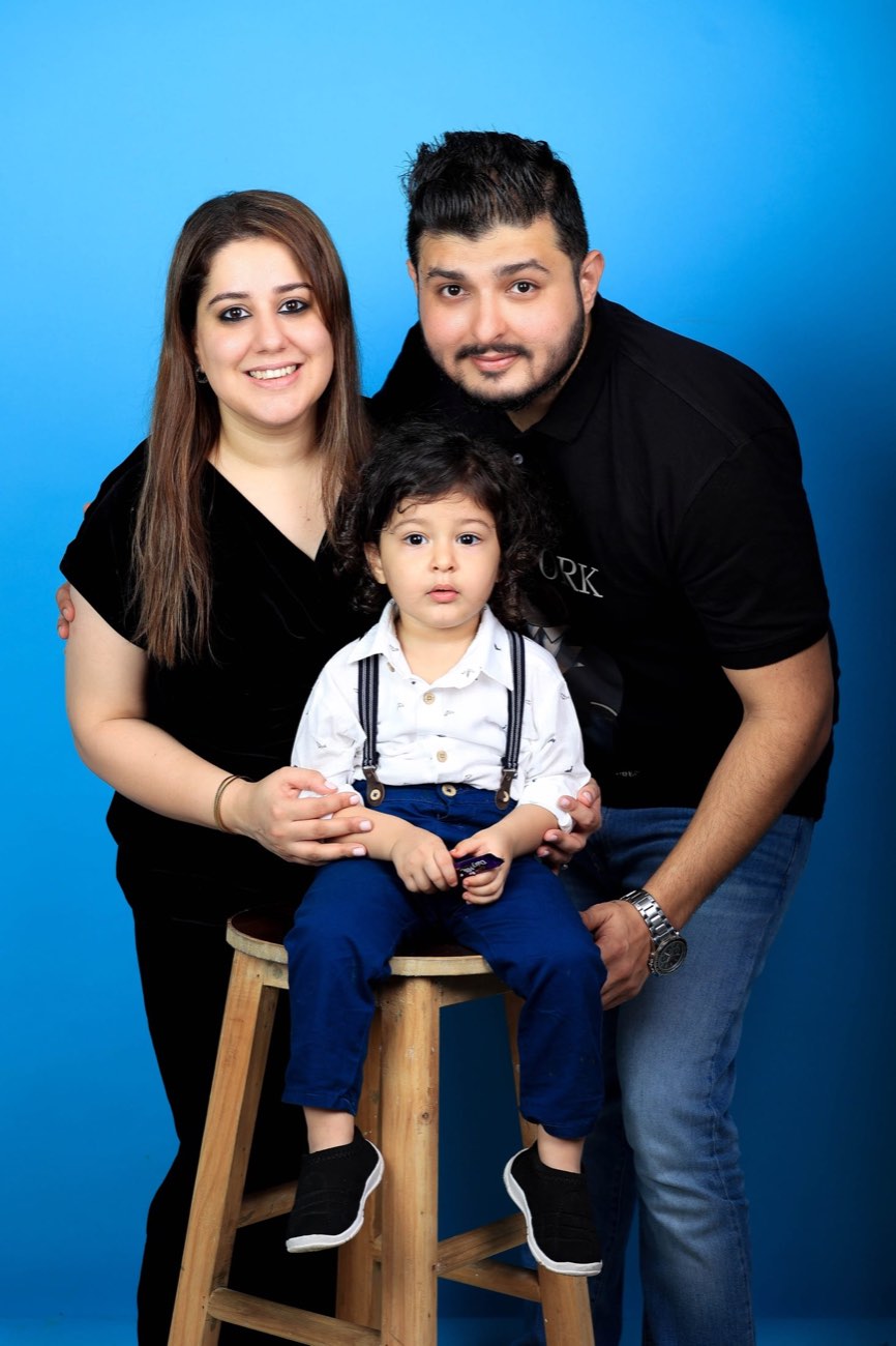 Family portrait with a young child in a studio